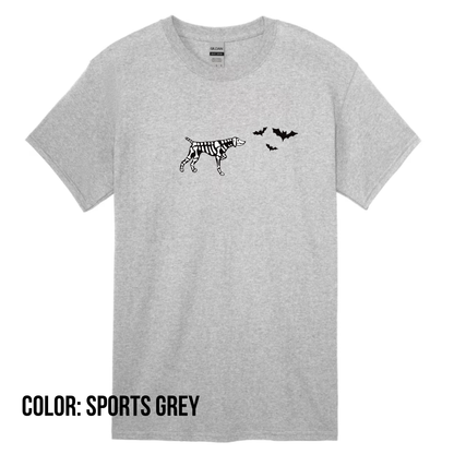 a grey t-shirt with a skeleton dog pointing at a group of flying bats